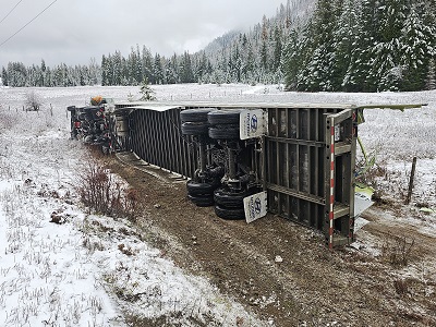 Commercial tractor-trailer flips onto its side