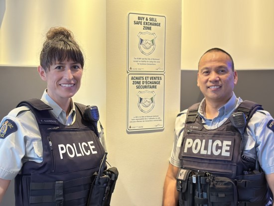 Two Richmond RCMP officers standing together